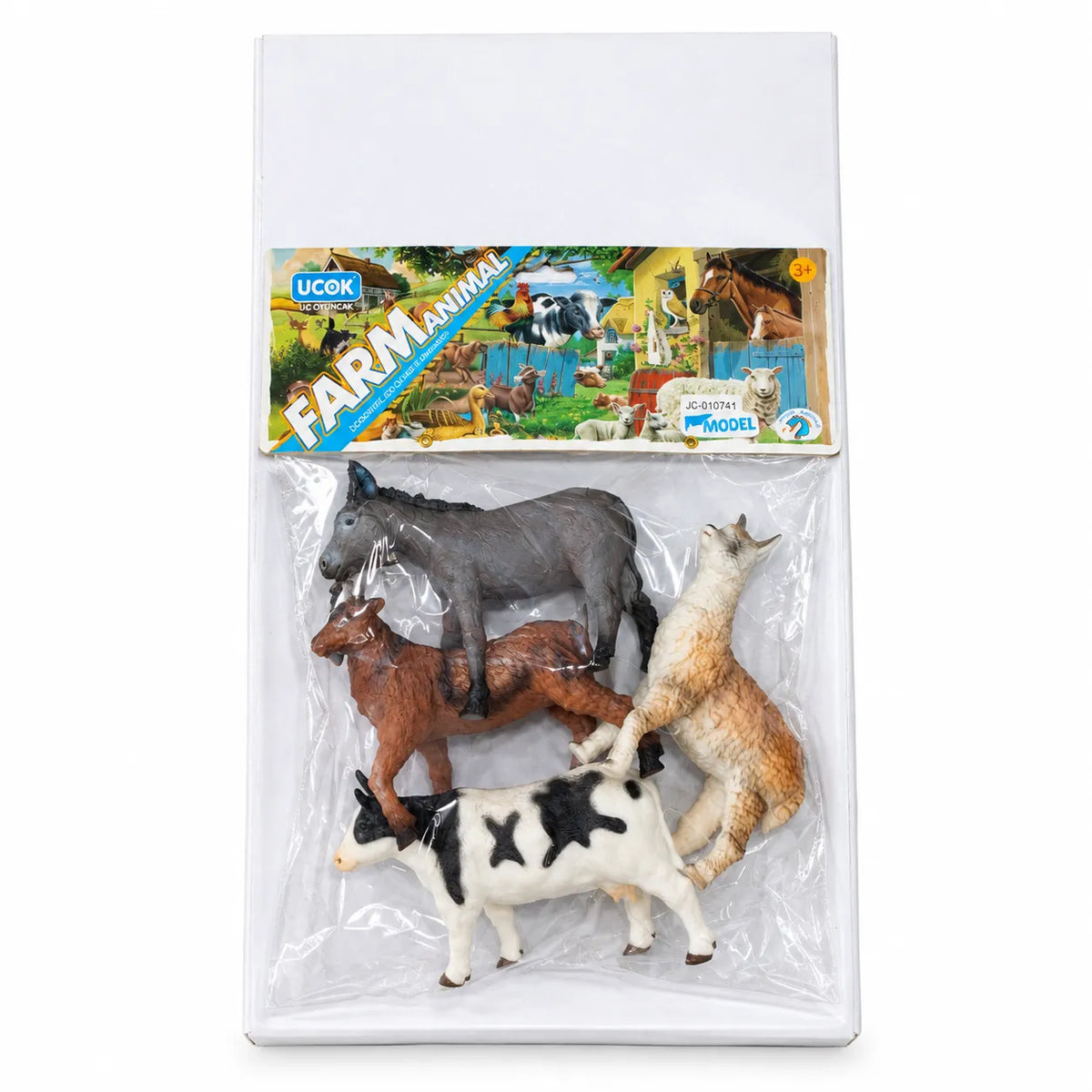 Four farm animal figures in a pack, including a black-and-white cow and grey donkey, with an ages 3+ label