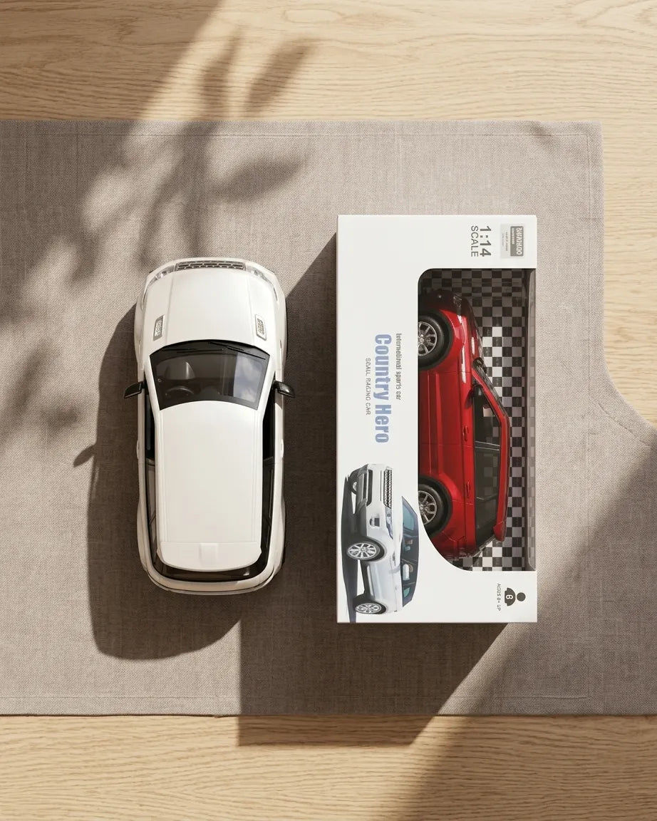 White 1:14 scale RC car and retail box, top-down view.